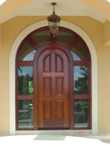 A long shot of the wooden door of the house